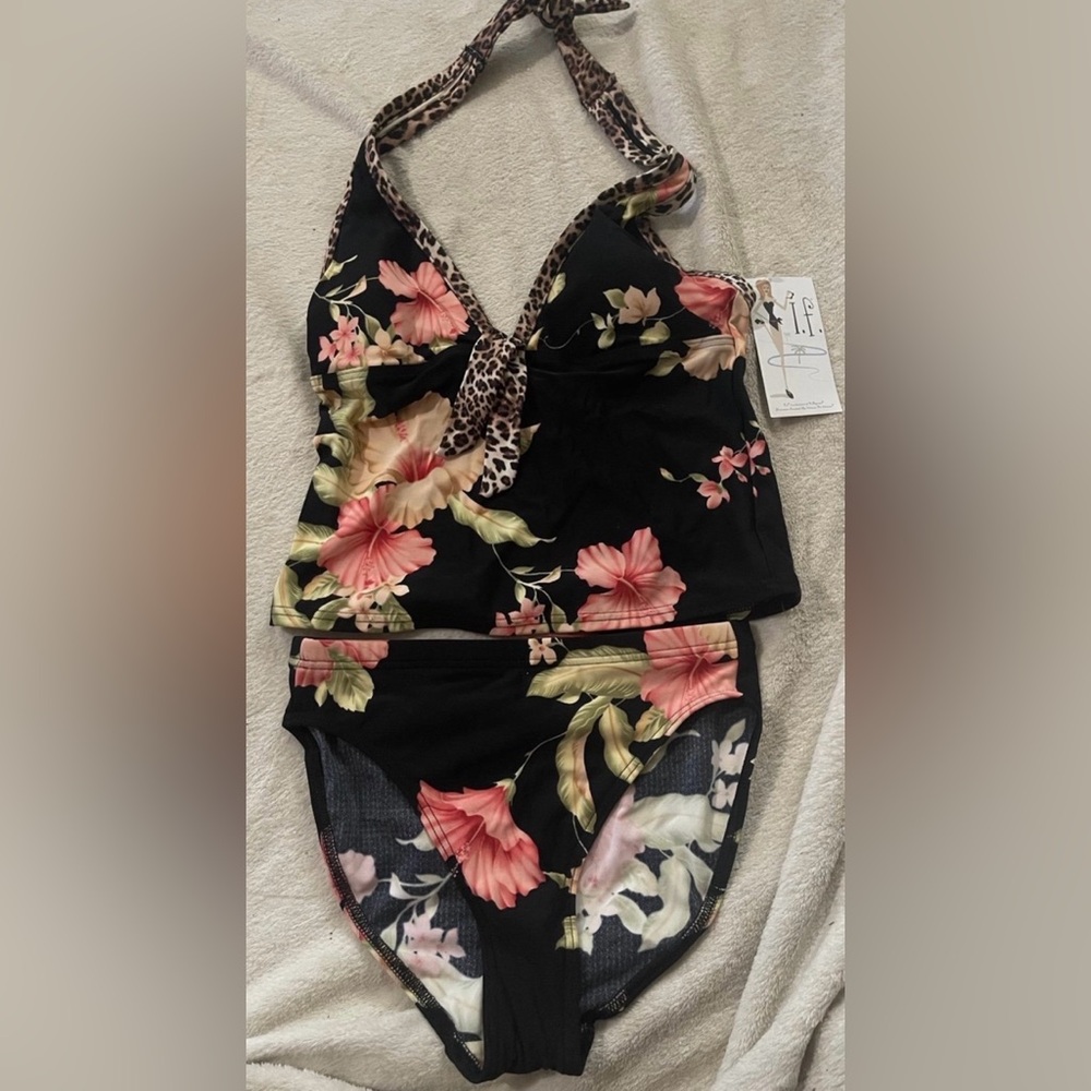 Floral black two piece bathing suit. ￼ Size 10. ￼